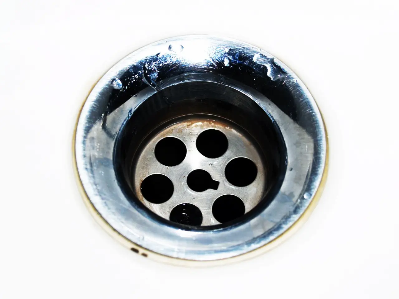 Close-up of a chrome sink drain